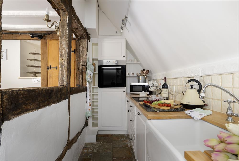 The charming galley kitchen at Corner Thatch, Abbots Morton