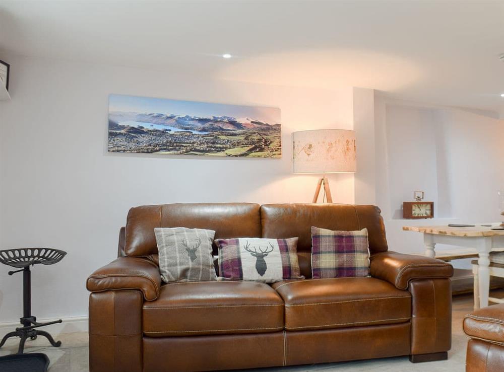 Comfortable living/ dining room at Cosey Cottage in Keswick, Cumbria