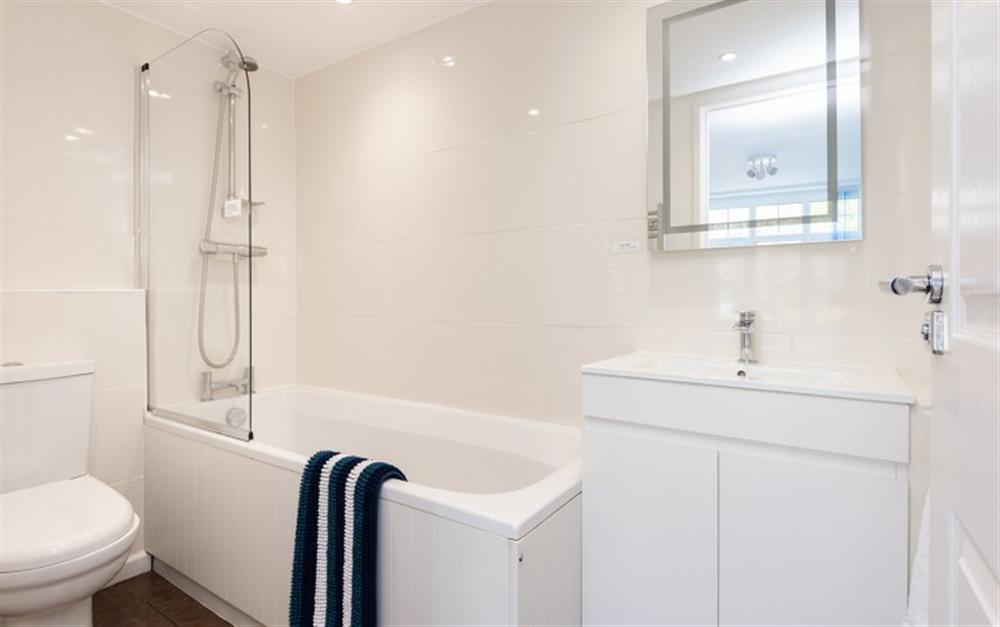 Bathroom with shower over bath at Cosy Corner in Lyme Regis