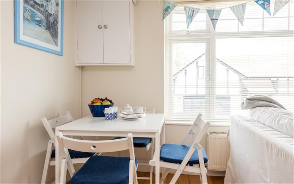 Seating for four in the open plan living/dining area at Cosy Corner in Lyme Regis