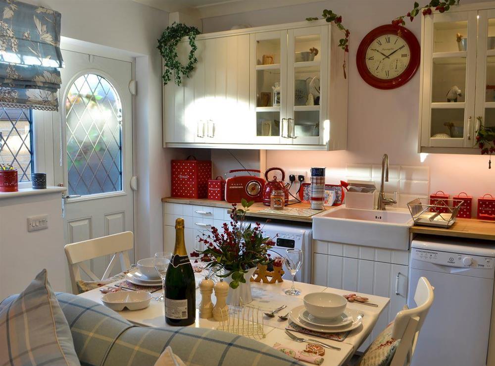 Kitchen and dining area at Cosy Cottage at the Conifers in Amble, Northumberland