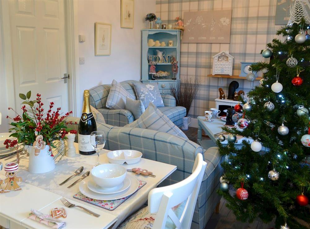 Shabby chic open plan living space at Cosy Cottage at the Conifers in Amble, Northumberland