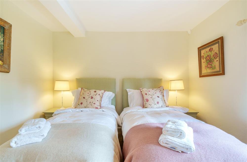 Bedroom two, with single beds available to be made up as a 6’ super-king  on request at Cosy Cottage, Dorchester
