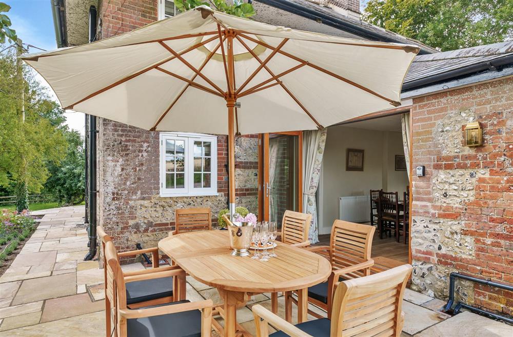 The rear patio with access to the open-plan kitchen and dining area at Cosy Cottage, Dorchester