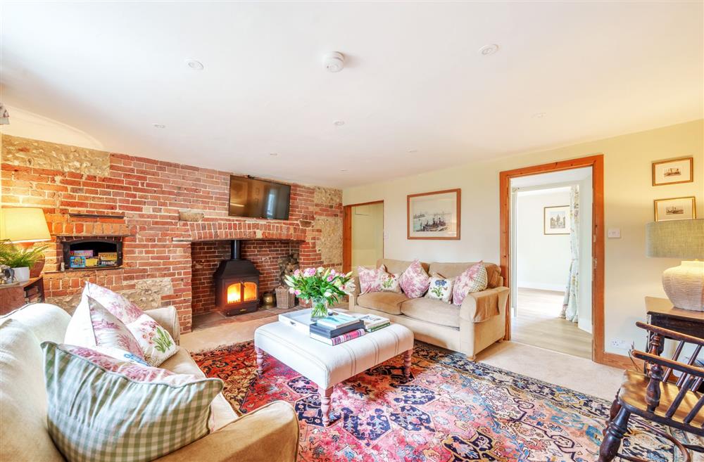 The sitting room with access to the open-plan kitchen and dining room at Cosy Cottage, Dorchester