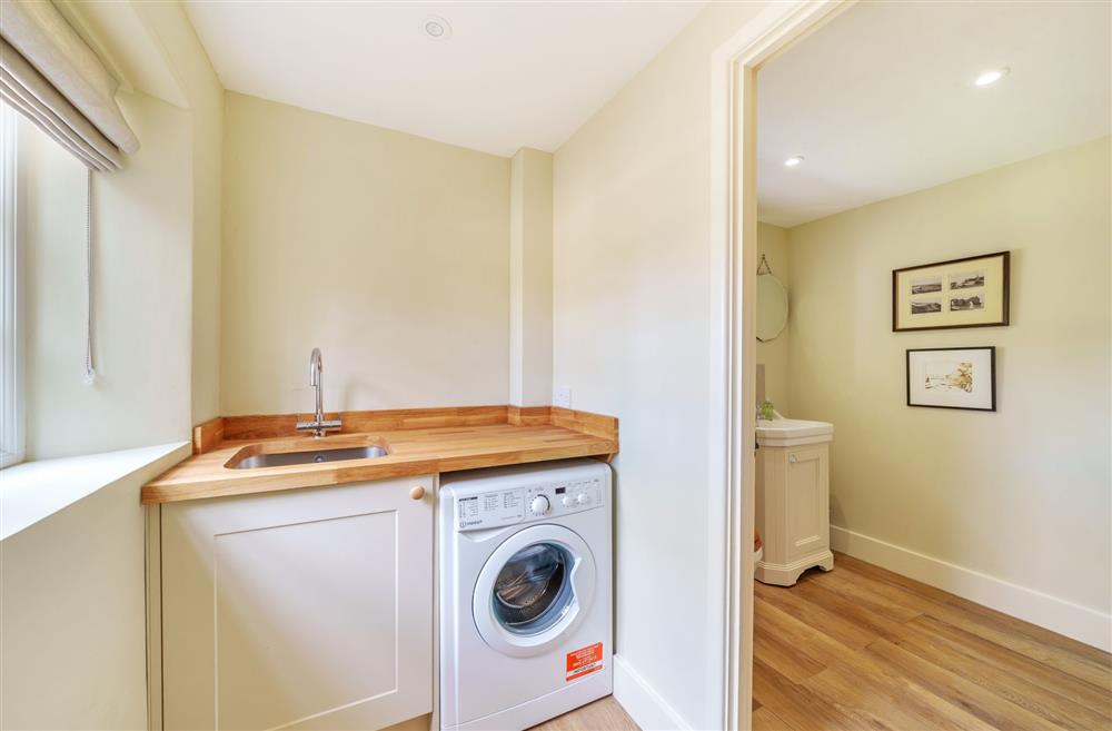 The utility room located on the ground floor at Cosy Cottage, Dorchester