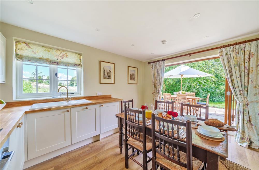 The well-equipped kitchen and dining area at Cosy Cottage, Dorchester