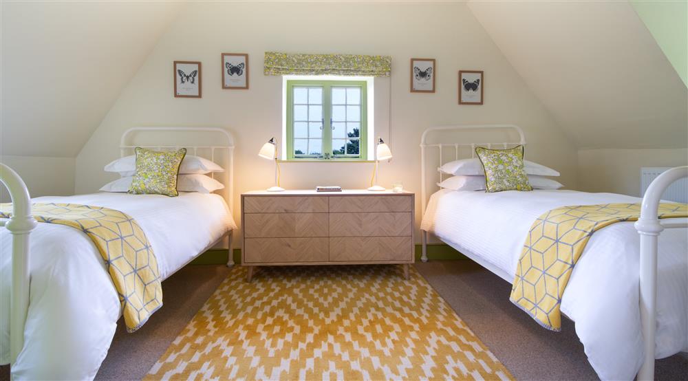 The twin bedroom at Cotehele Dairy Cottage in Saltash, Cornwall