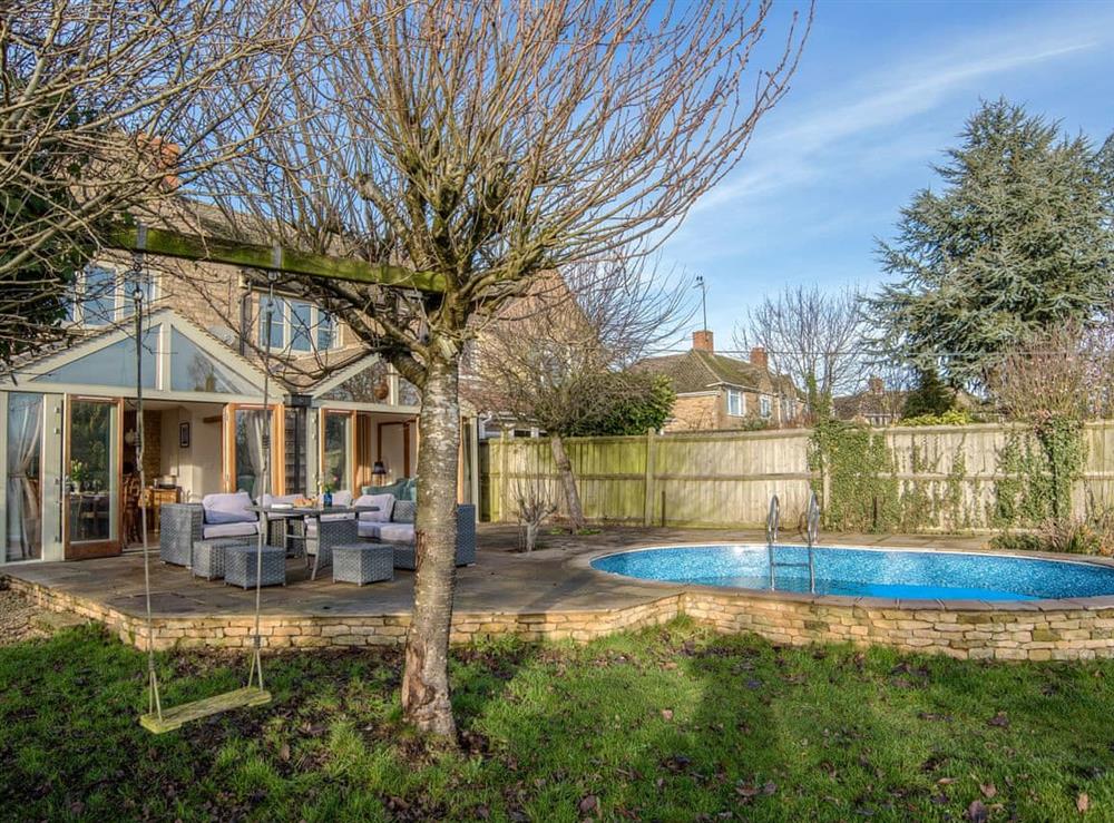Large garden with private swimming pool at Cotswolds Country House in Kingham, near Chipping Norton, Oxfordshire