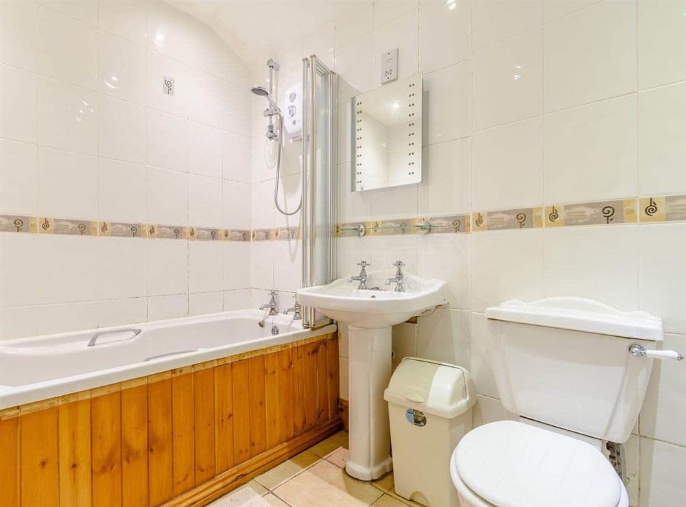 Bathroom with shower over bath at Cottage in the Pond in Garton, near Hornsea, North Humberside