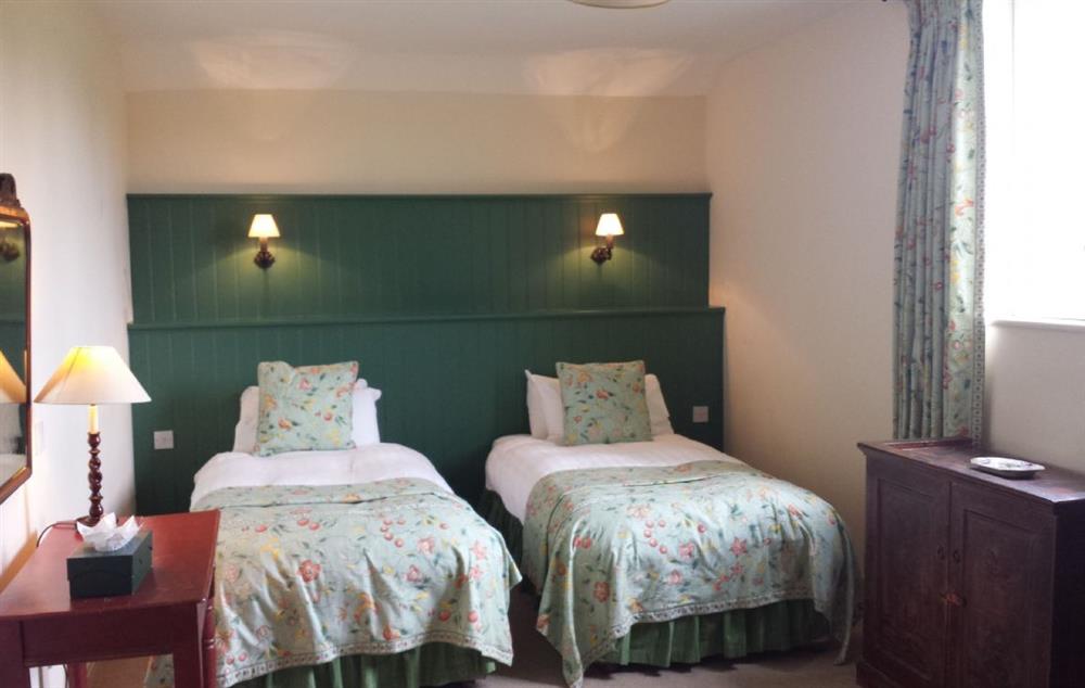 The twin bedroom has specially designed beds (can be converted into twin beds on request) and original furniture