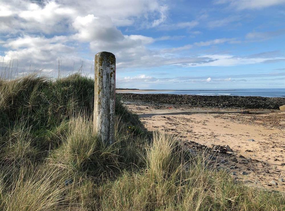 View of shoreline and beach down from Inverallochy Golf Course at Cotton Shore in Inverallochy, near Fraserburgh, Aberdeenshire