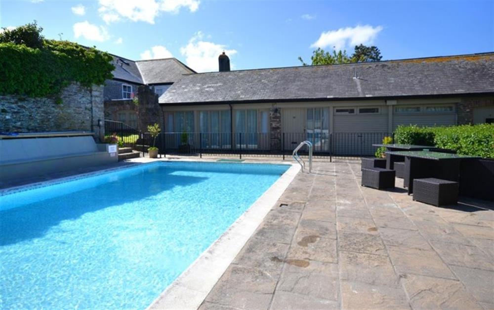 Another view of the outdoor heated swimming pool. at Court Barton Cottage No. 1 in South Huish