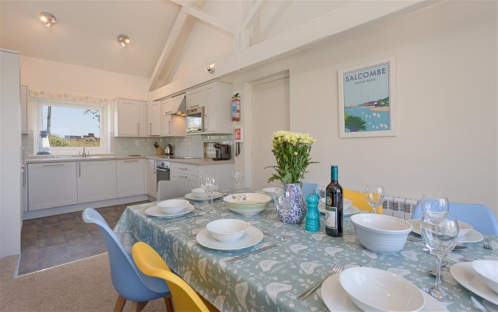 The dining and kitchen area at Court Barton Cottage No. 11 in South Huish