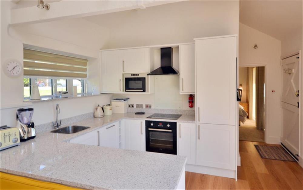 The stylish and modern kitchen at Court Barton Cottage No. 5 in South Huish