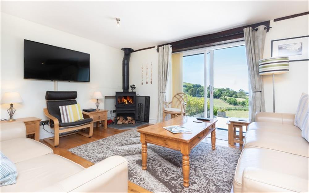 The stylish sitting room with log burner at Court Barton Cottage No. 6 in South Huish