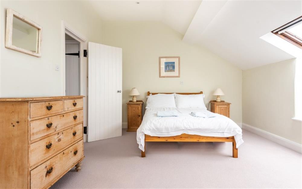 Bedroom 2 with double bed and en suite shower room at Court Barton Cottage No. 8 in South Huish