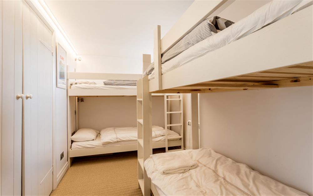 The dorm room with two sets of bunk beds