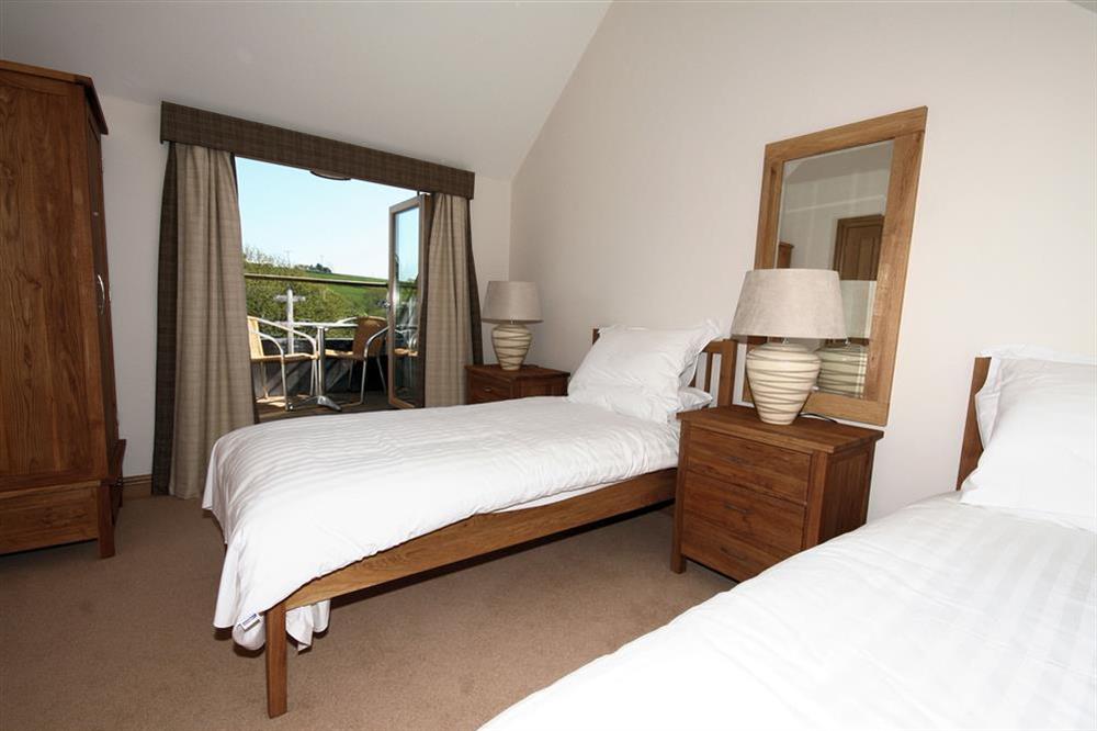 Twin Bedroom with French Doors Leading to Balcony at Court Cottages 2 in Hillfield, Dartmouth