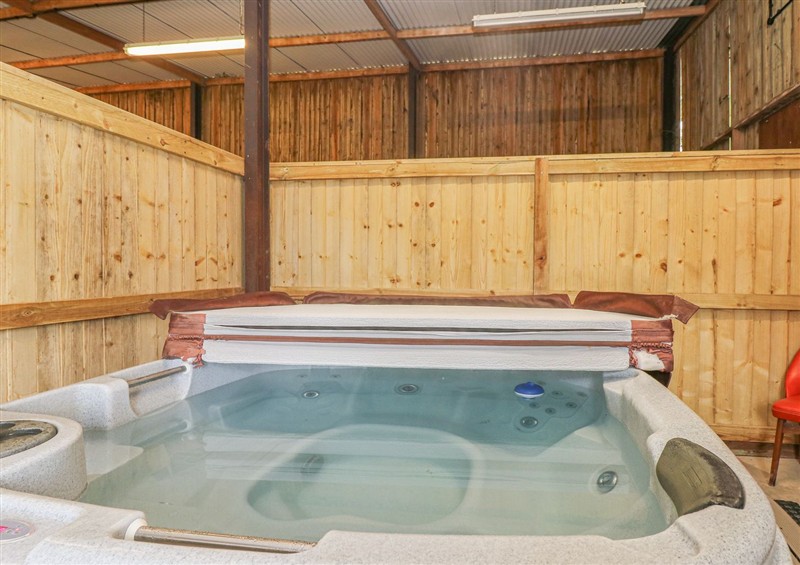 There is a hot tub at Court House Farmhouse, Charmouth
