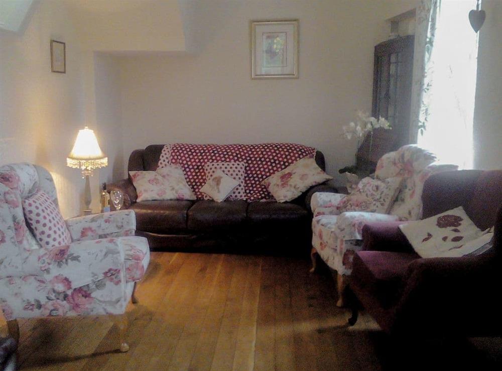 Comfy seating within the living room at Court House in Hay-on-Wye, Powys