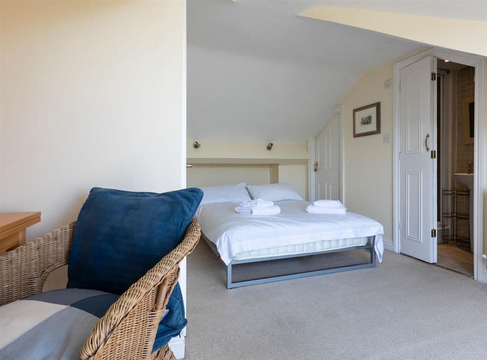 Double bedroom with ensuite shower room and french doors to balcony at Courtenay Street 5 in Salcombe, Devon