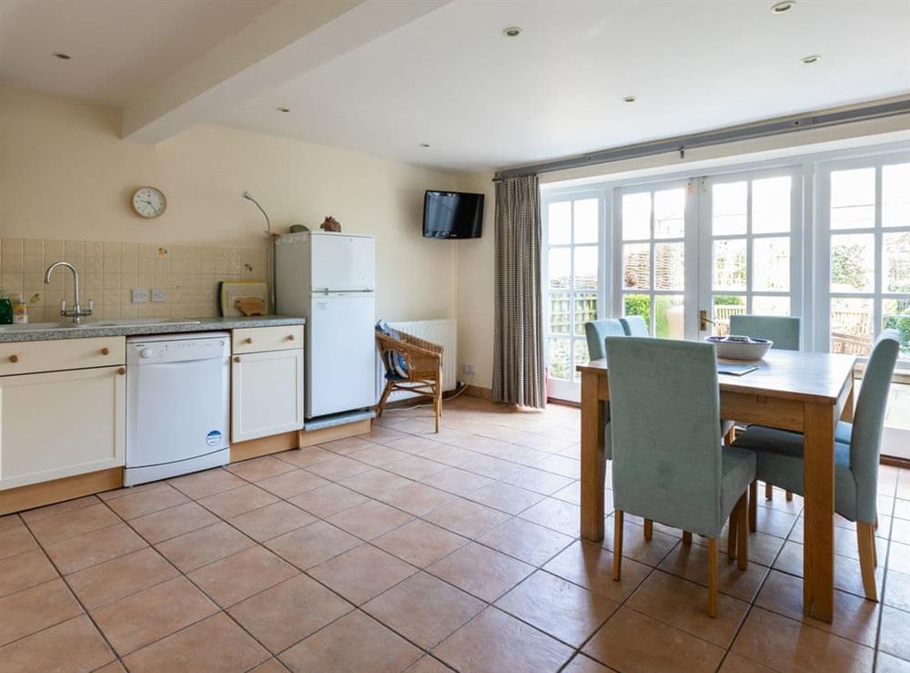 Lower ground floor kitchen, dining room with double glazed doors to patio at Courtenay Street 5 in Salcombe, Devon