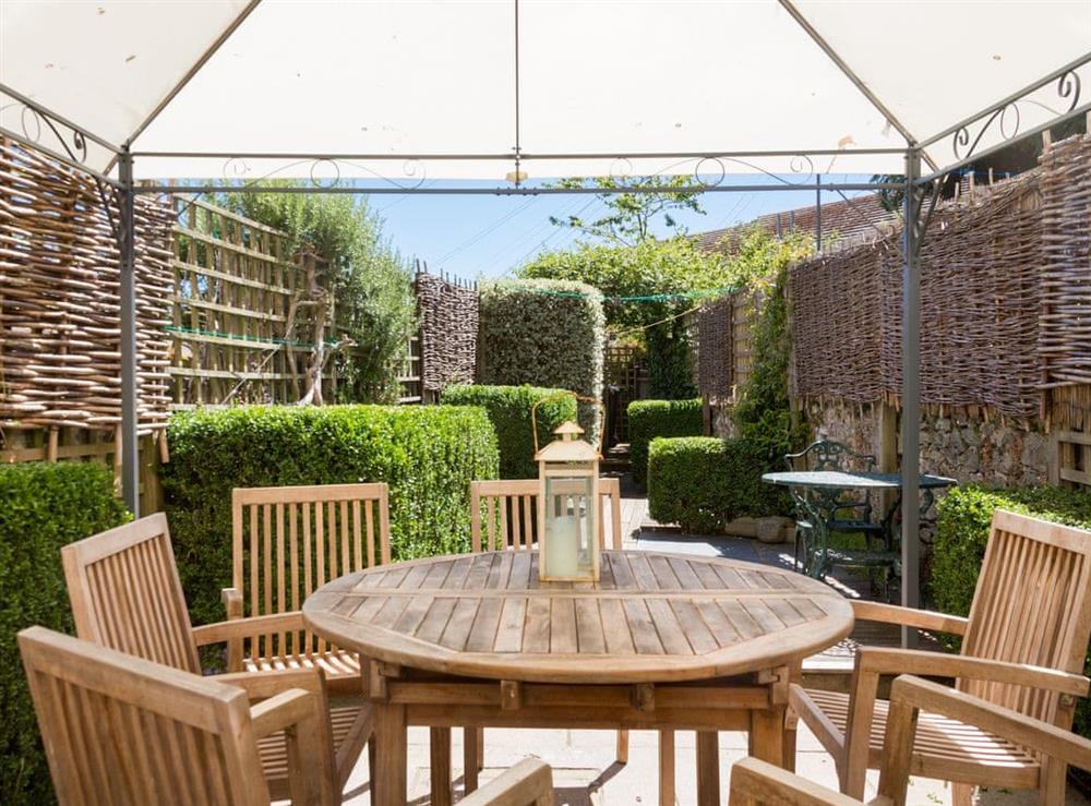 Pretty patio and garden with decking and outdoor furniture at Courtenay Street 5 in Salcombe, Devon