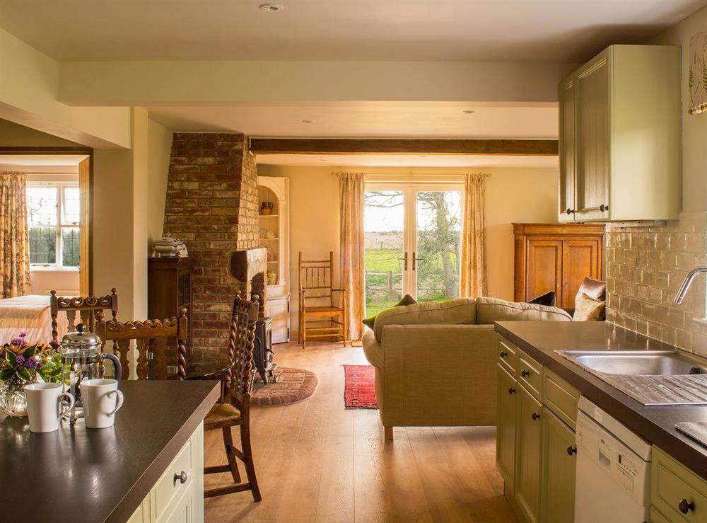 Stylish living area with wooden floor throughout at Courtside in Fairfield, near Appledore, Kent