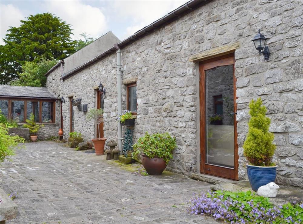 Delightful stone-built holiday home at Courtyard Cottage at Dam Hall Barn in Peak Forest, near Buxton, Derbyshire