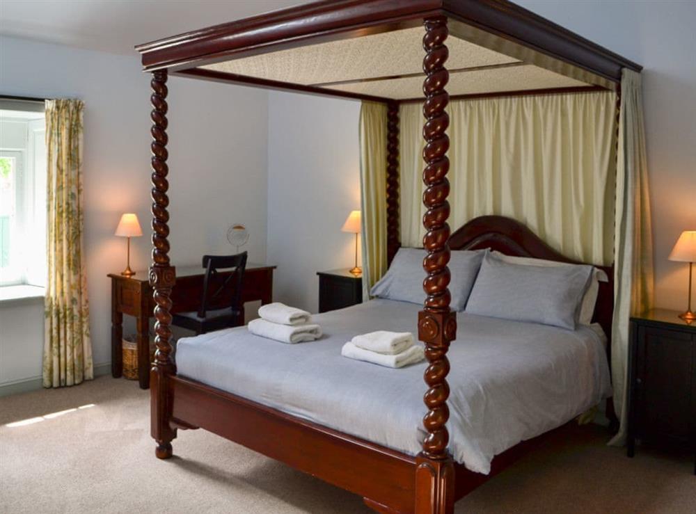 Four poster bedroom at Courtyard Cottage in Gordon, Berwickshire