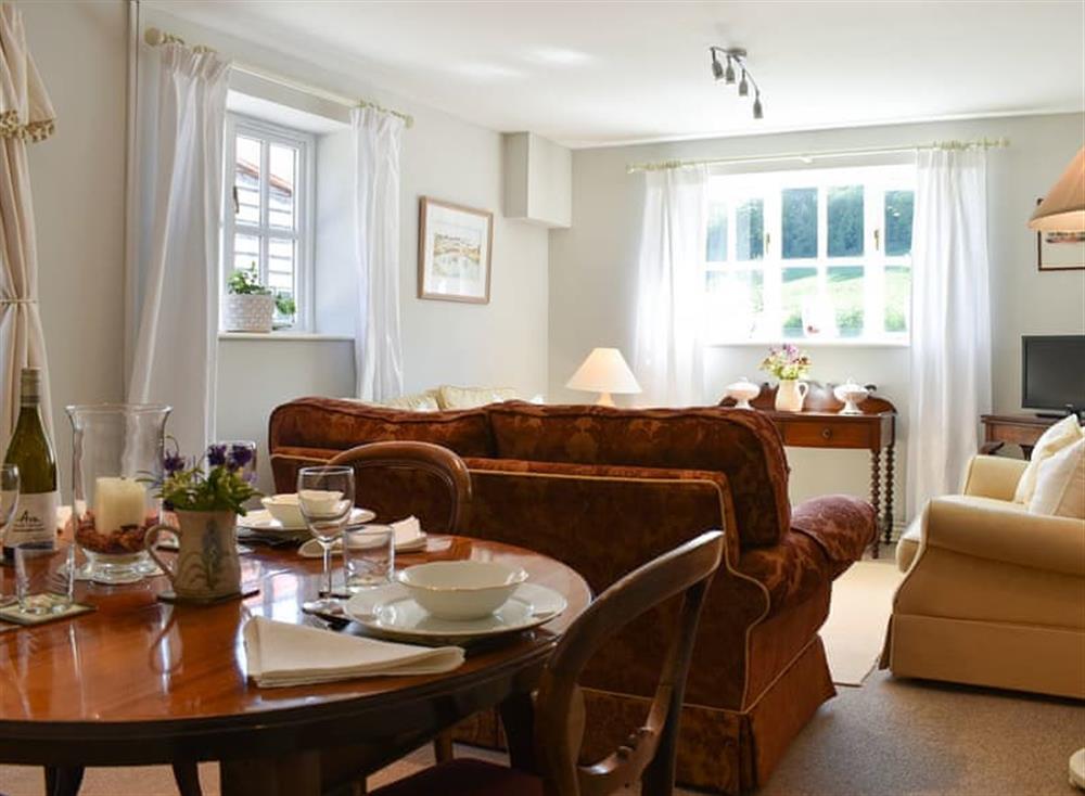 Living room/dining room at Courtyard Cottage in Owlpen, near Dursley, Gloucestershire
