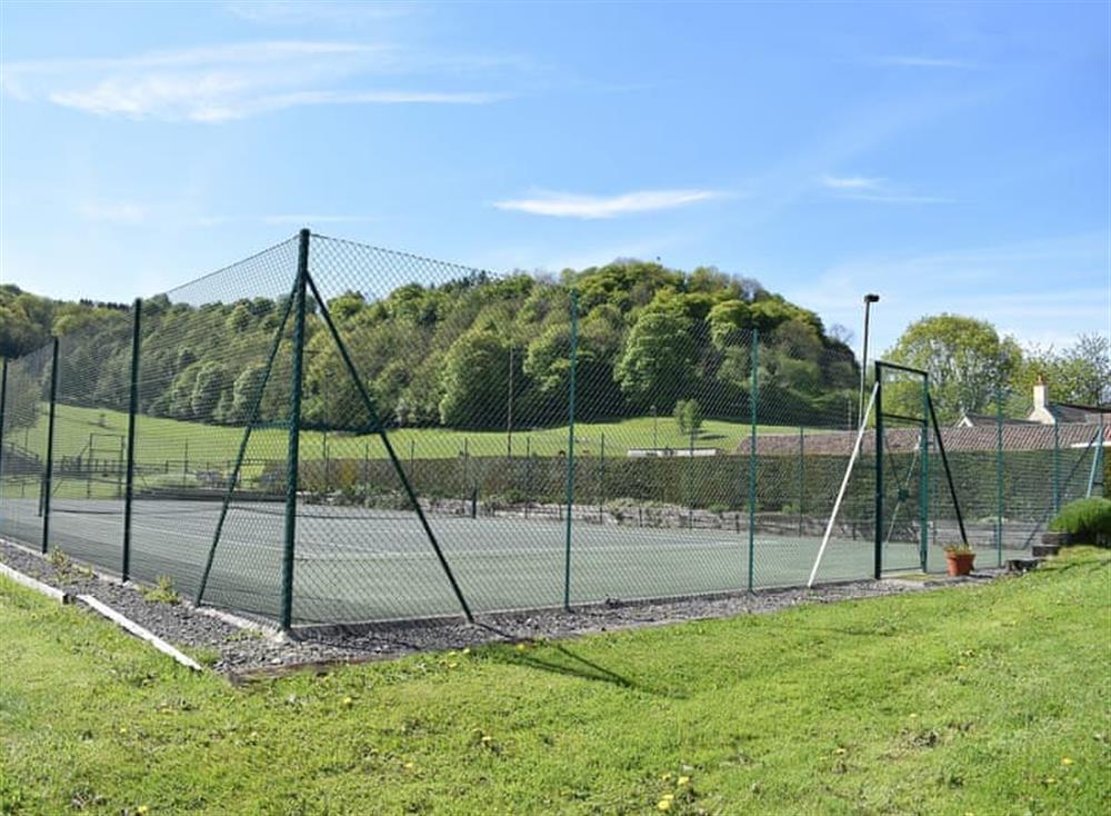 Tennis court at Courtyard Cottage in Owlpen, near Dursley, Gloucestershire