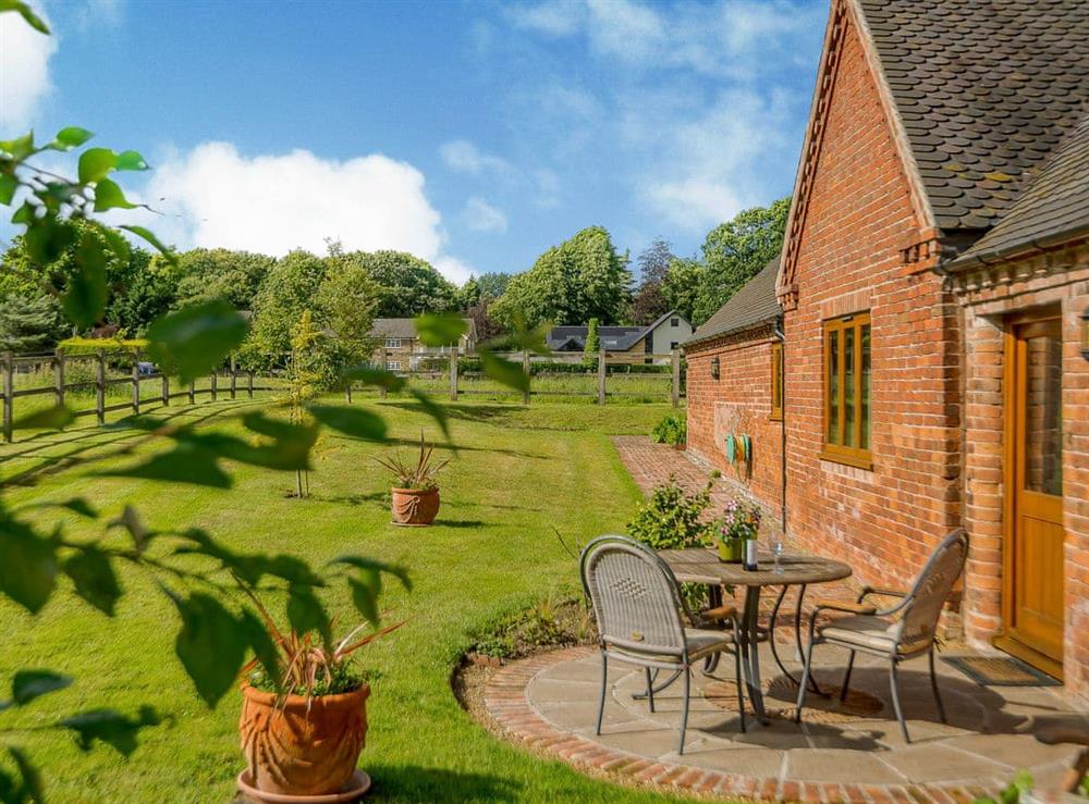 Large lawned garden with patio (photo 2) at Courtyard Lodge in Rufford, near Newark, Nottinghamshire