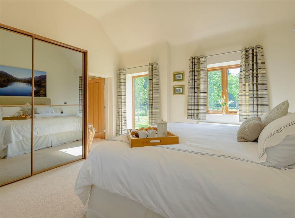 Romantic double bedroom with super kingsize bed (photo 3) at Courtyard Lodge in Rufford, near Newark, Nottinghamshire