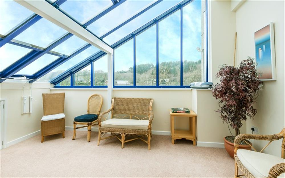 The conservatory is ideal for a play area for the children or a quiet read. at Cove 1 in Maenporth