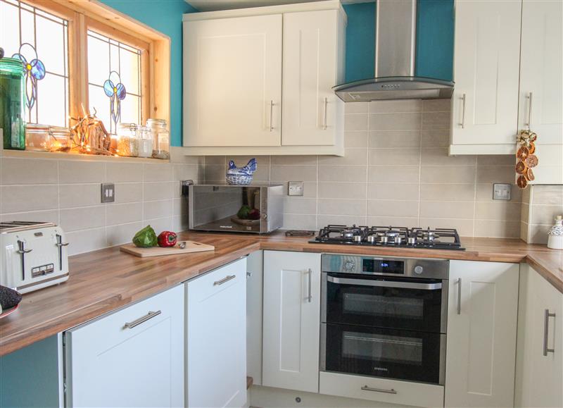 This is the kitchen at Cove Cottage Hideaway, Chiswell On Portland