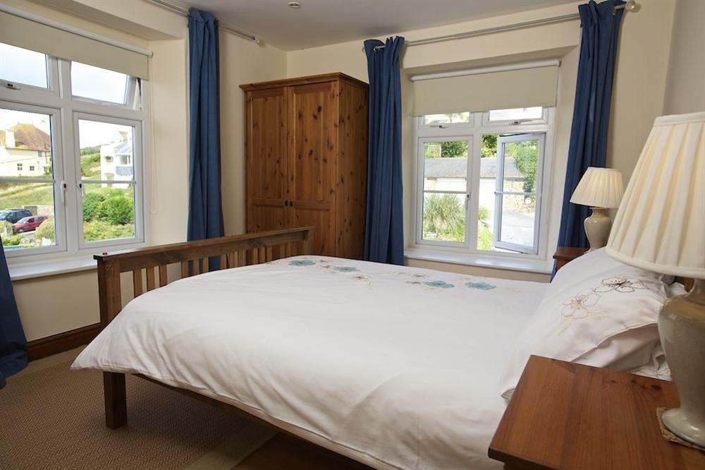 Master bedroom with King-size bed at Cove Cottage in Hope Cove, Nr Kingsbridge