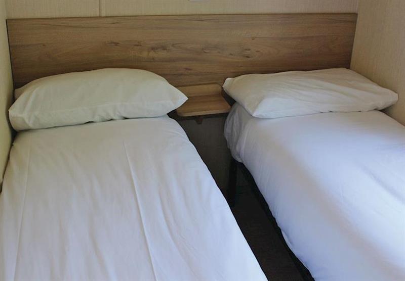A twin bedroom at Cove Holiday Park in Portland, Weymouth