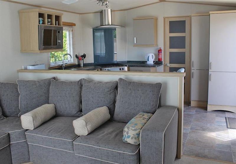 Living area and kitchen in a Brightstone at Cove Holiday Park in Portland, Weymouth