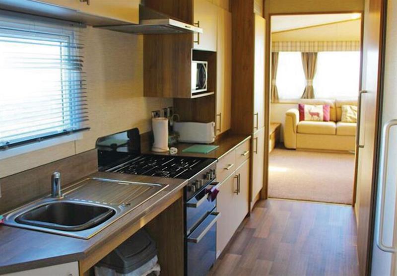 The kitchen at a Brightstone at Cove Holiday Park in Portland, Weymouth