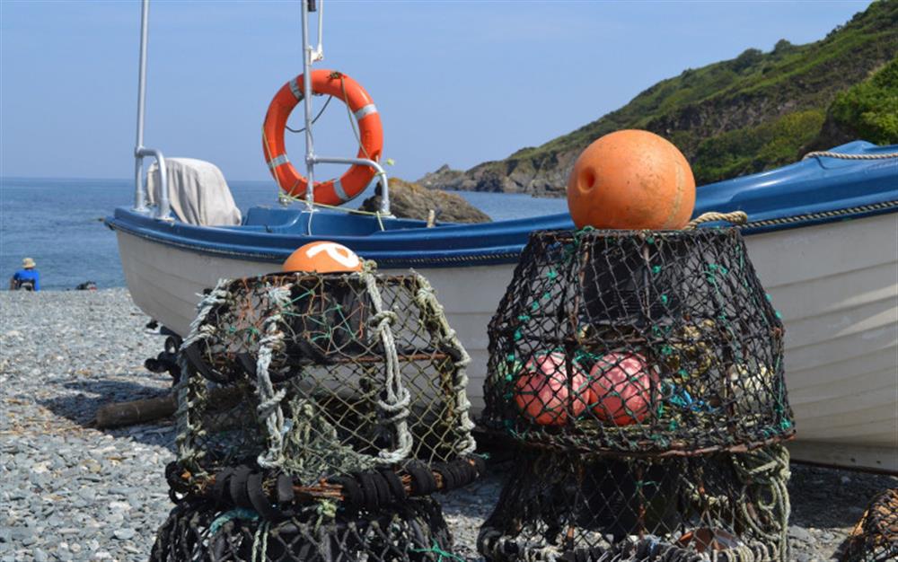 Fishing boats and lobster pots are often spotted on the beach - a truly Cornish village feel. at Cove View in Porthallow