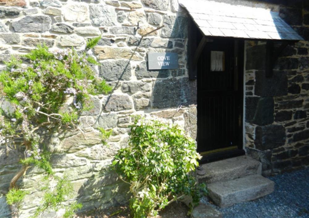 Two granite steps lead up to the front door. at Cove View in Porthallow