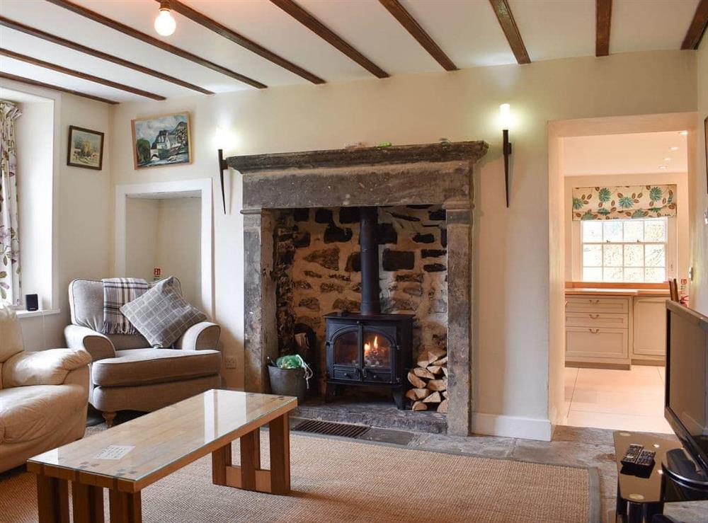 Cosy living room with wood burner at Covercote at Horsehouse in Horsehouse, near Leyburn, North Yorkshire