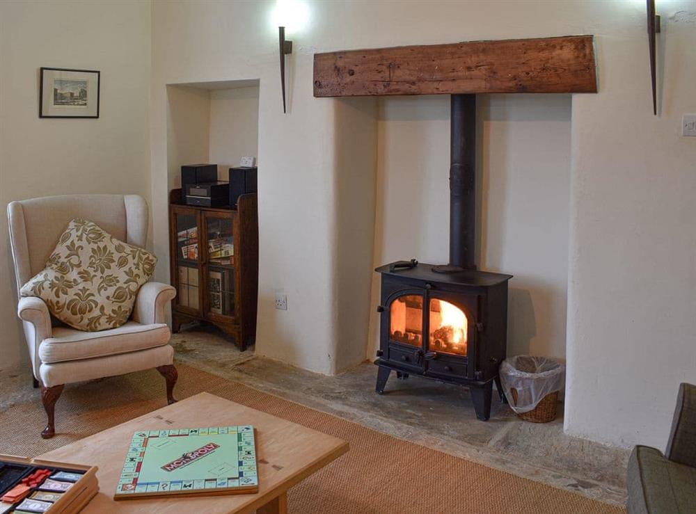 Sitting room with wood burner at Covercote at Horsehouse in Horsehouse, near Leyburn, North Yorkshire