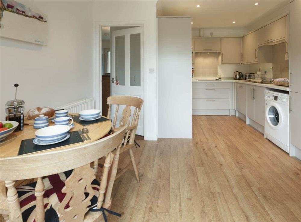 Well-equipped kitchen with dining area at Covert Cottage in Diss, Norfolk