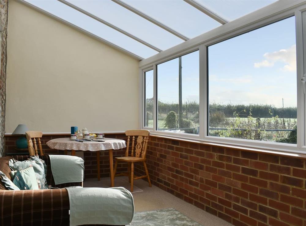 Light and airy conservatory overlooking the garden at Cowdea 2 in Bettiscombe, Dorset