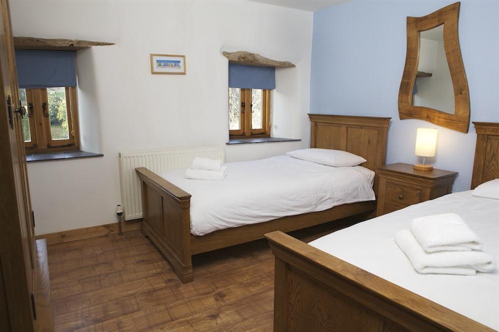 Twin bedroom with two single beds at Cowslip Cottage in Frogmore, Nr Kingsbridge