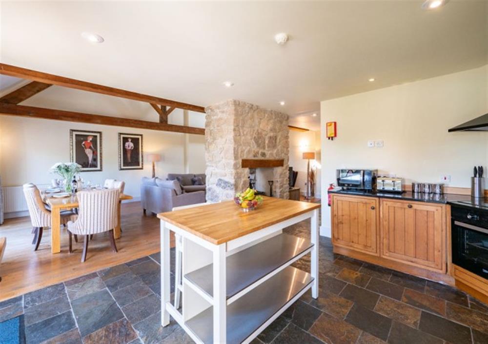 Kitchen open-plan to the dining area and sitting room at Cox Tor in Chagford