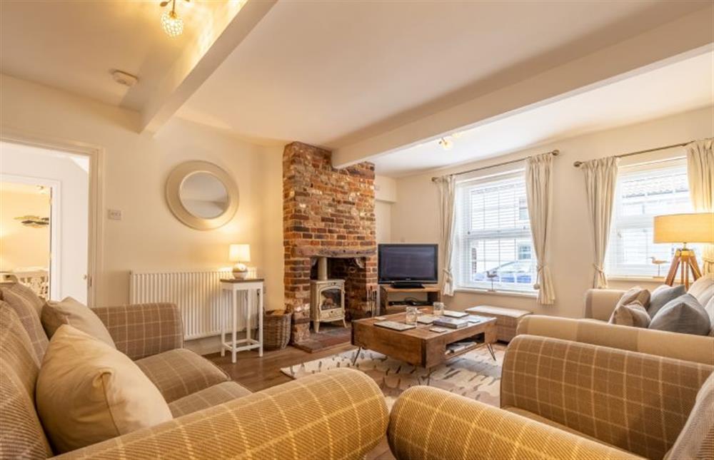 Coxswainfts House: Sitting room with a log burning stove